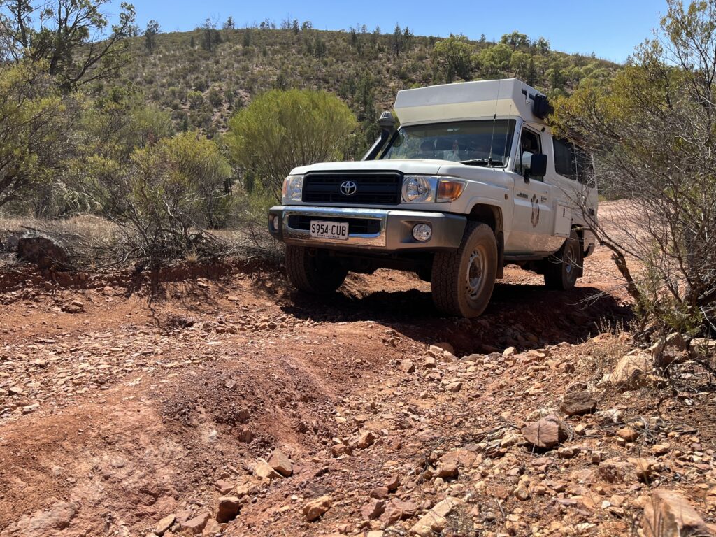 4WD Motorhome training driving in steep Rocky terrain